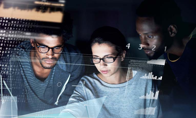 Three people looking at data