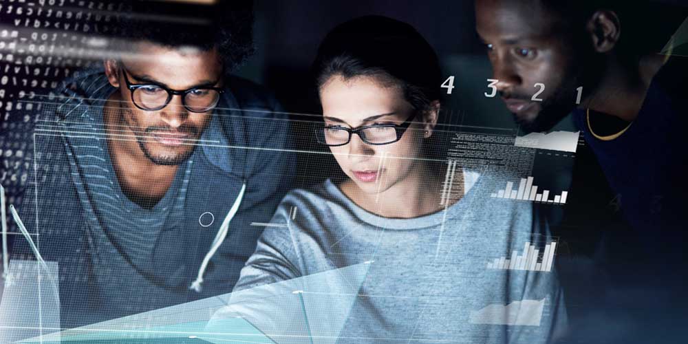 Three people looking at data